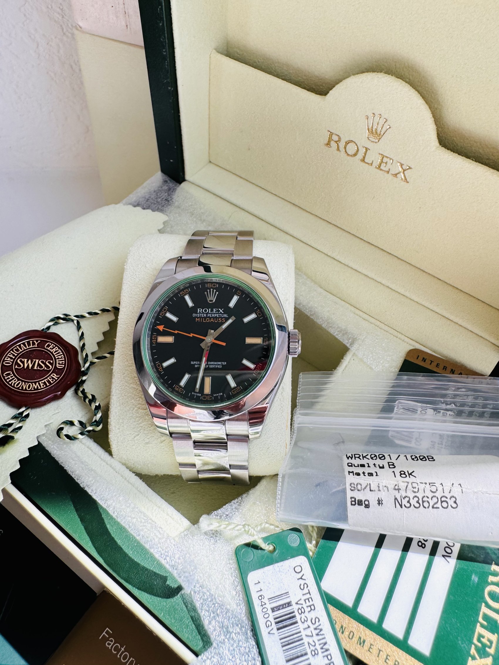 Rolex Milgauss 116400GV, black dial with green sapphire crystal and orange lightning-bolt seconds hand, in its box