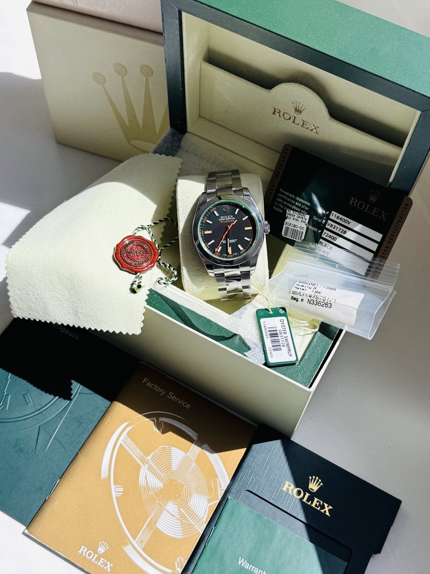 The complete set: outer and inner box, booklets, tags, cloth and warranty card